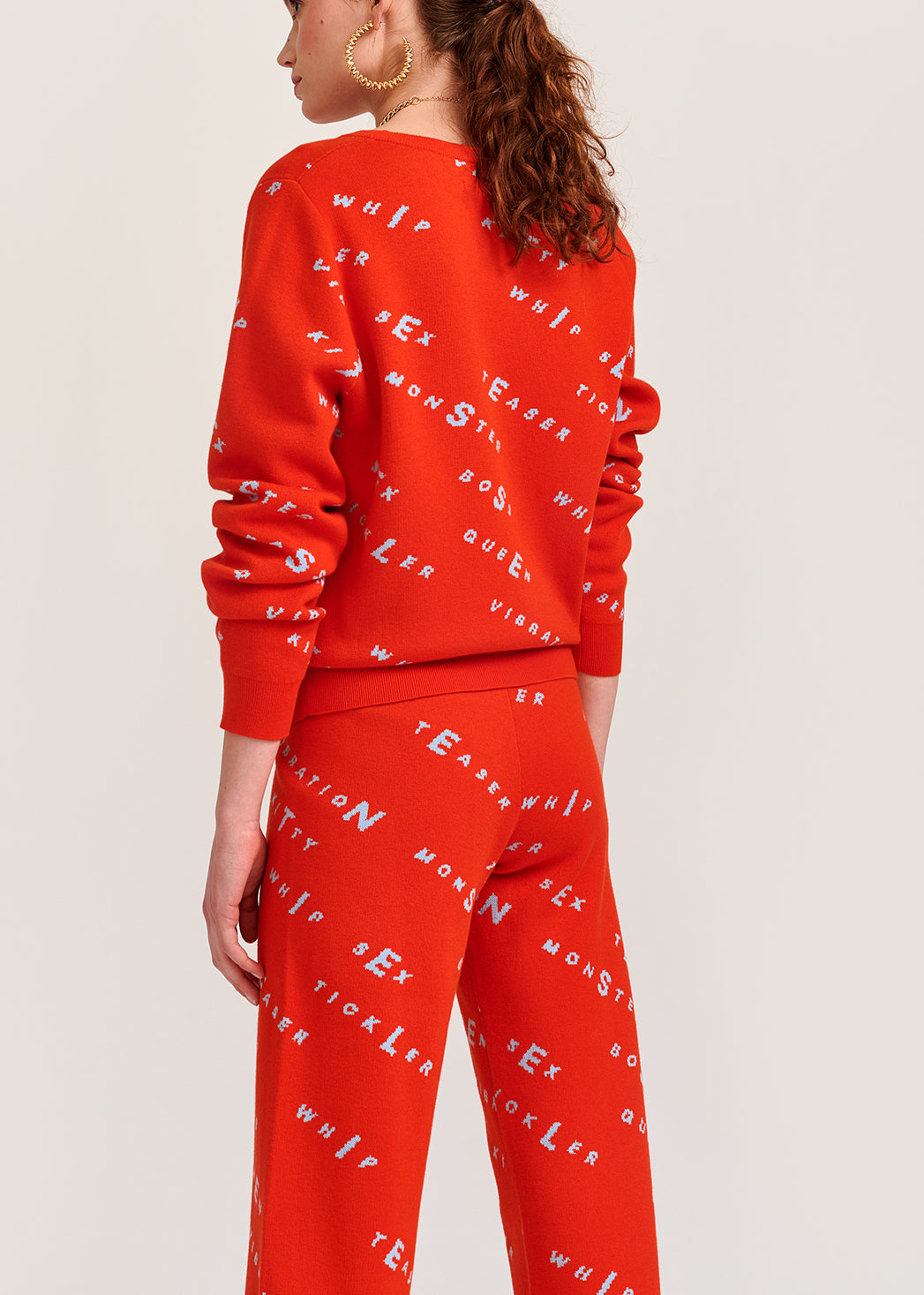 Orange knitted sweater with light blue print RE—SSENTIEL | Essentiel second hand