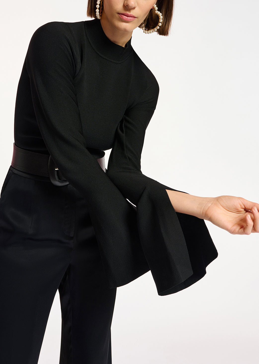 Black slim-fit knit sweater with trumpet sleeves RE—SSENTIEL | Essentiel second hand