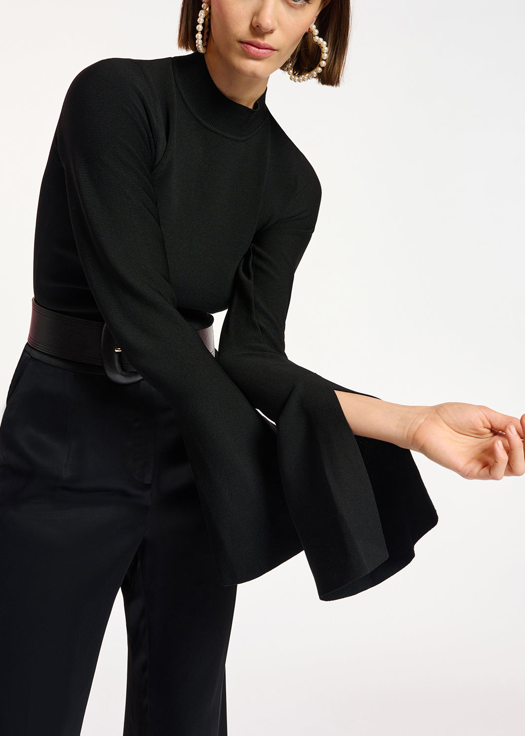 Black slim-fit knit sweater with trumpet sleeves RE—SSENTIEL | Essentiel second hand