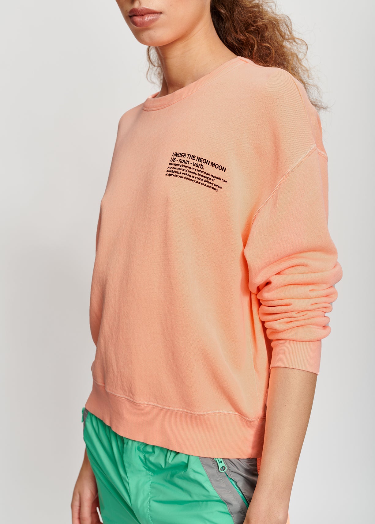 Light blue cotton sweatshirt with orange UNDER THE NEON MOON print RE—SSENTIEL | Essentiel second hand