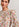 Gebroken witte top met ruches en bloemenprint Faume - seconde main