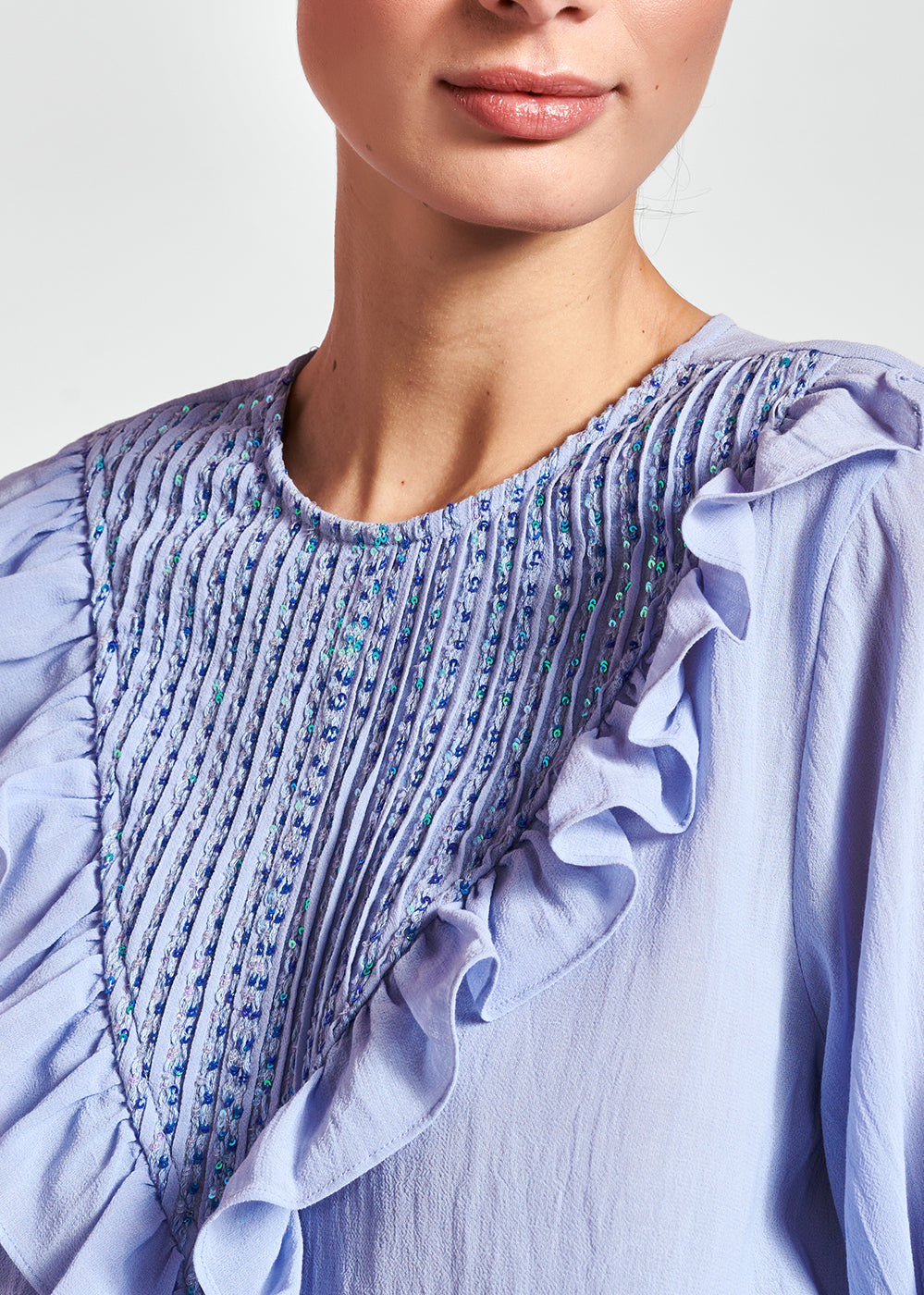 Lichtblauwe top met ruches en pailletten RE—SSENTIEL | Essentiel second hand