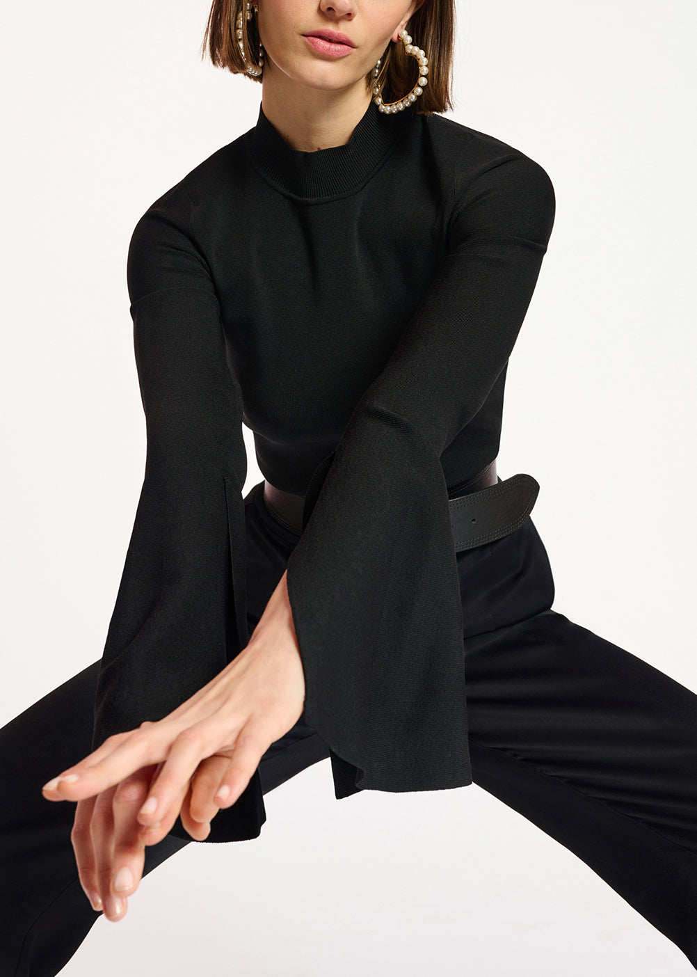 Black slim-fit knit sweater with trumpet sleeves RE—SSENTIEL | Essentiel second hand