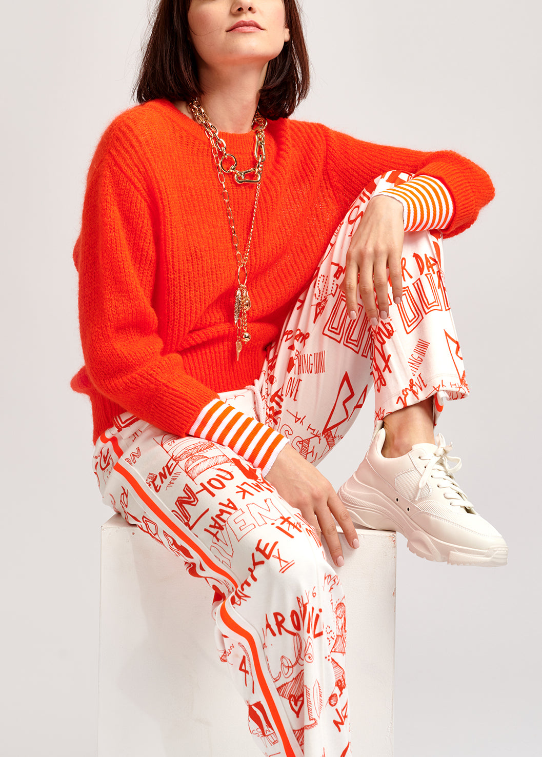 Neon orange ribbed-knit sweater with striped neon cuffs RE—SSENTIEL | Essentiel second hand
