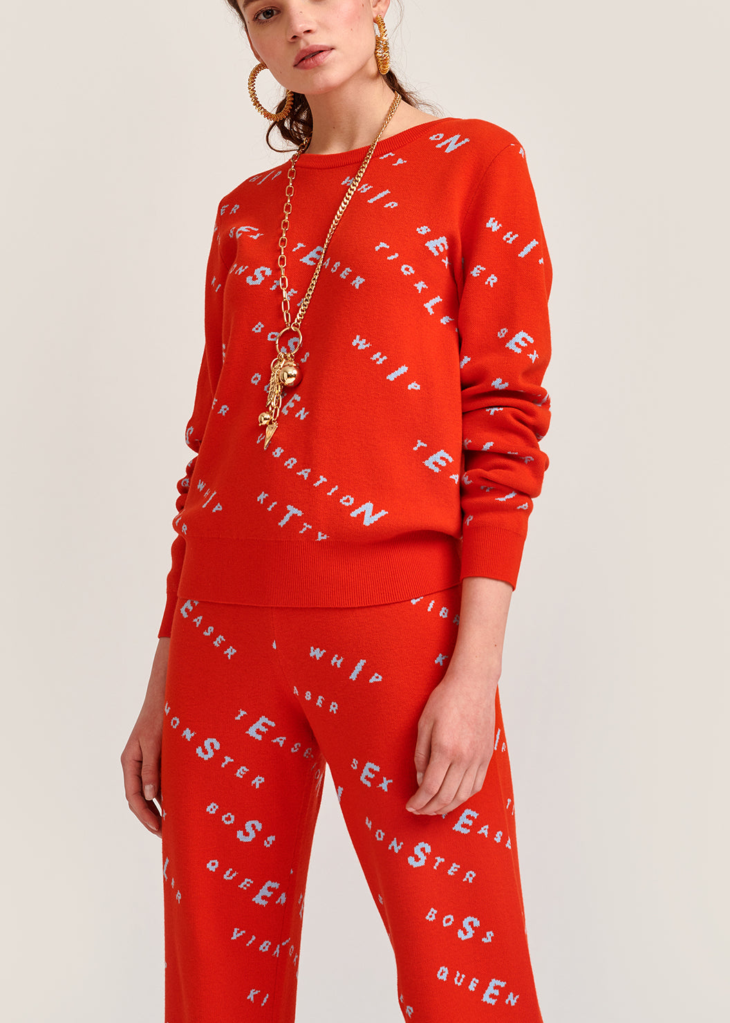 Orange knitted sweater with light blue print RE—SSENTIEL | Essentiel second hand