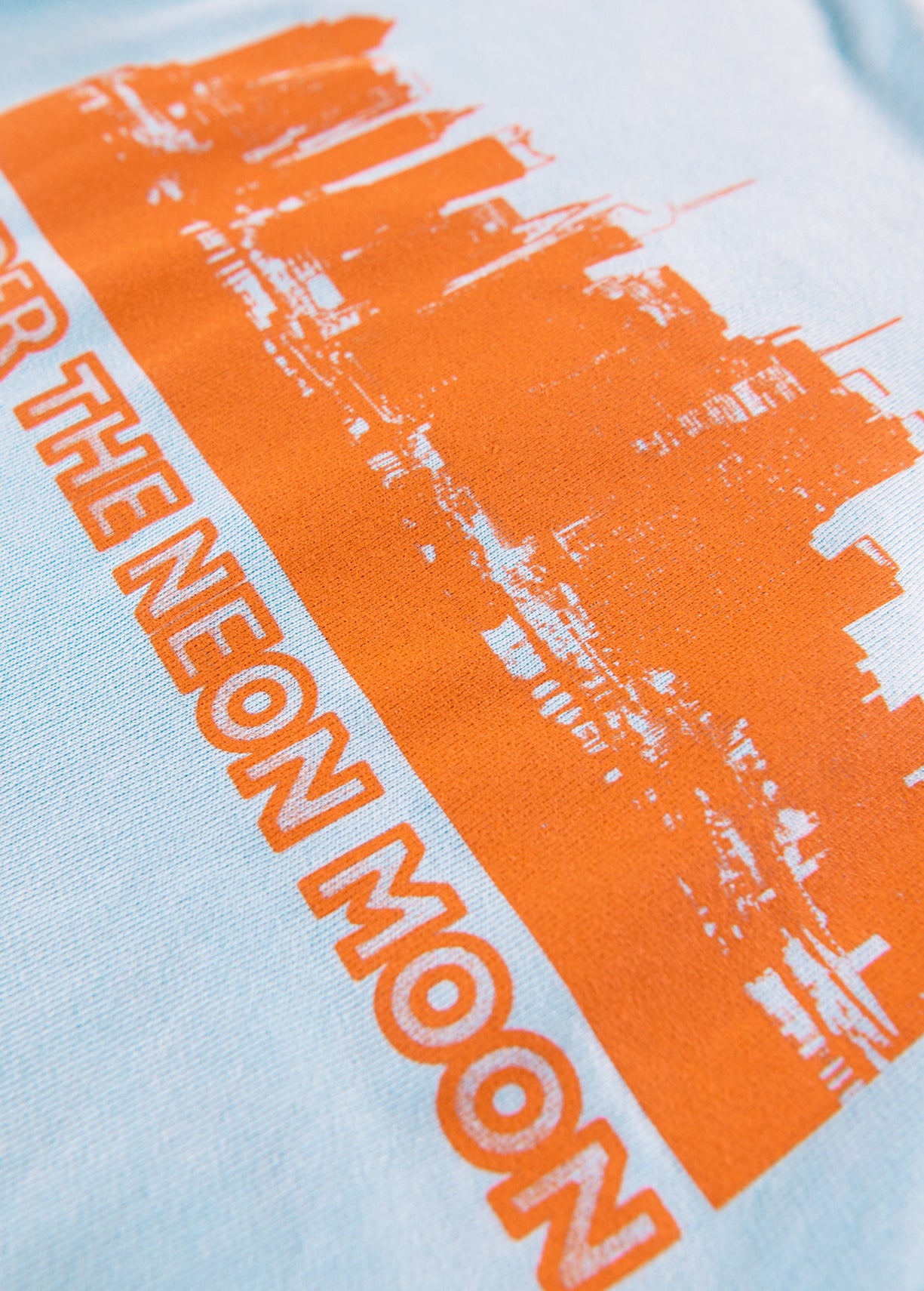 Light blue cotton sweatshirt with orange UNDER THE NEON MOON print RE—SSENTIEL | Essentiel second hand