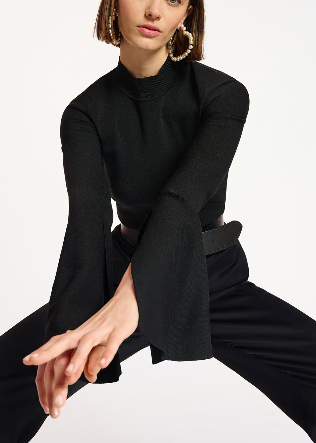 Black slim-fit knit sweater with trumpet sleeves RE—SSENTIEL | Essentiel second hand