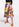 Midirok met zwart, oranje en gele bloemenprint Faume - seconde main